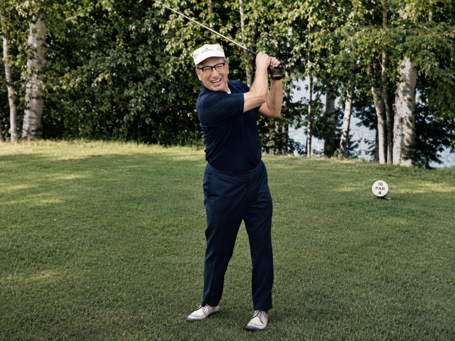 Peter Green swinging a golf club on a fairway