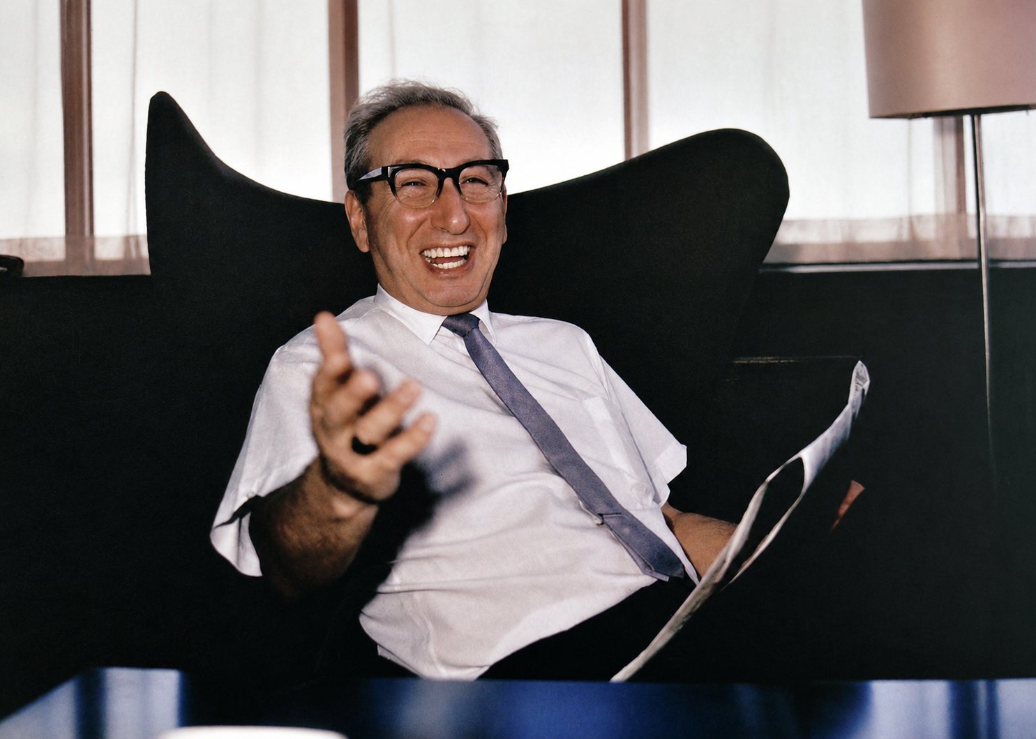 Peter Green laughing in an office chair
